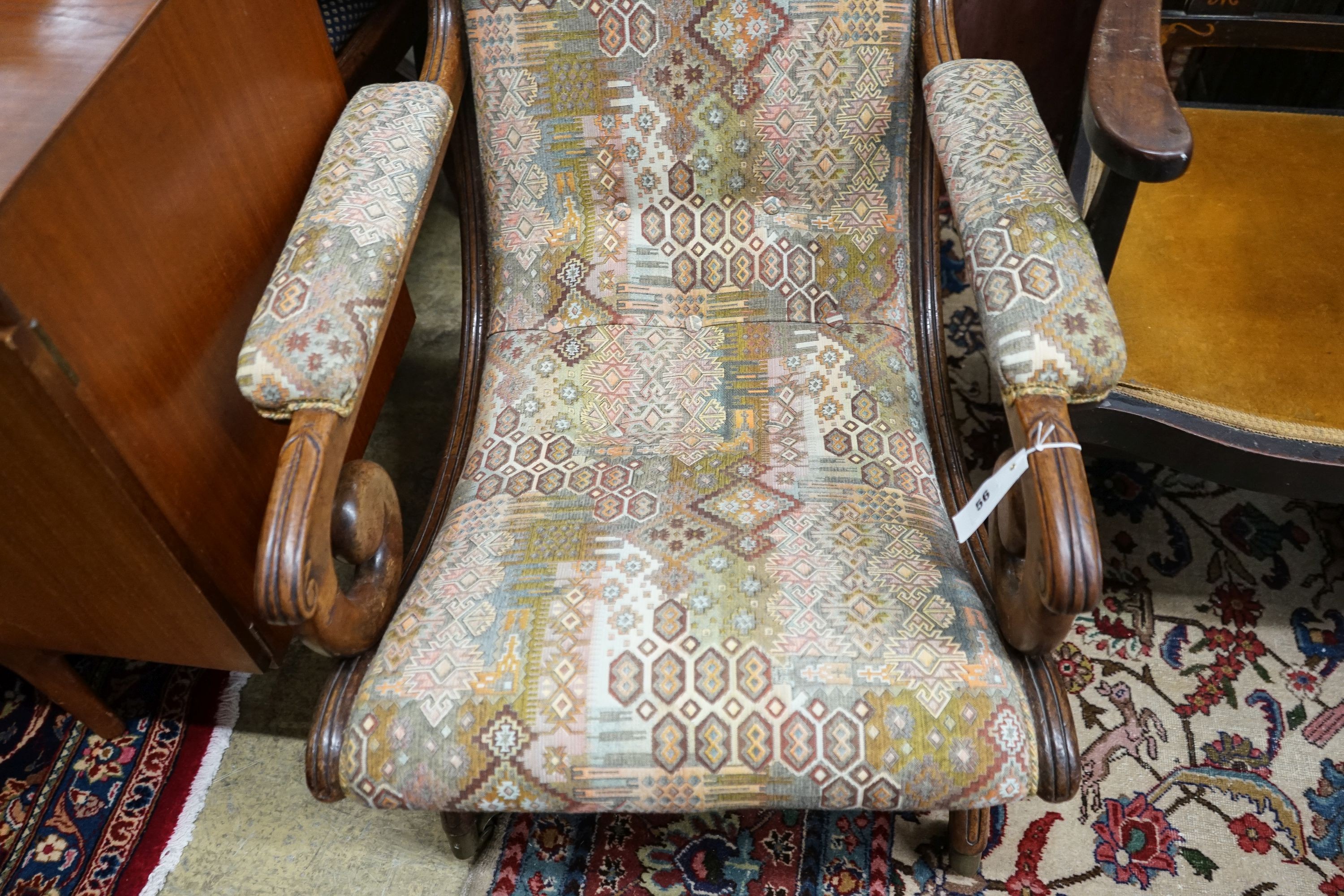 A Regency mahogany scroll armchair